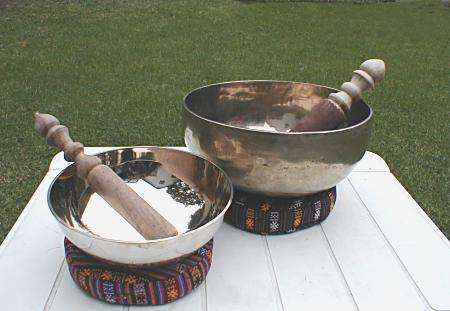 Tibetan bowls shown with pillows and sticks